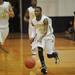 Huron senior Kendall Thomas moves the ball down the court in the second half against Pinckney during a district match up at Pioneer on Wednesday. Melanie Maxwell I AnnArbor.com